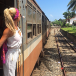 Eco-friendly traveler exploring countryside by train