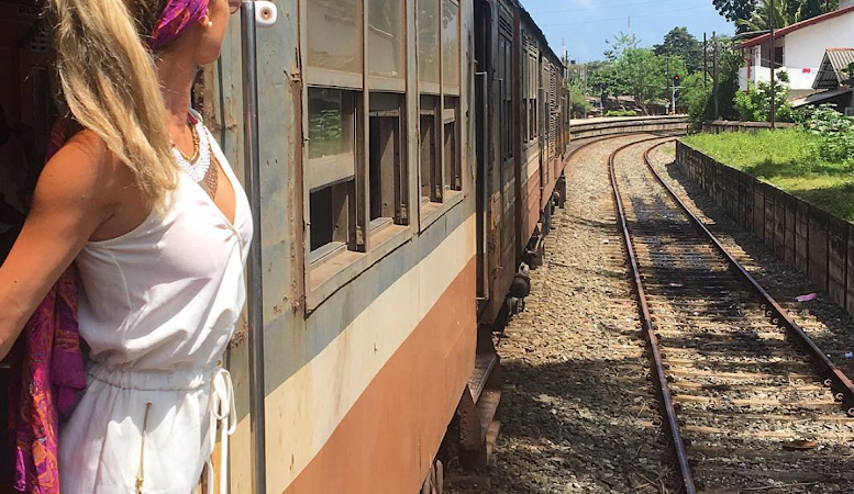 Eco-friendly traveler exploring countryside by train