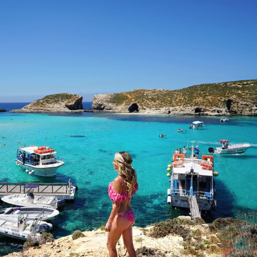 Female traveler in top European destination Malta, at the Blue Lagoon.