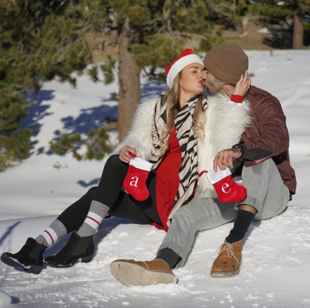 travel couple kissing in snow
