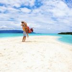 solo travel couple on the beach