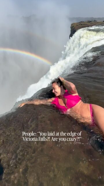 I prefer the word “adventurous”. Would you do this? Read first for context!

This is the notorious “Devil’s Pool” at the top of Victoria Falls, on the border of Zambia and Zimbabwe!

I will not tell you it’s not dangerous or that it’s safe, just that the locals have created a safe-as-possible experience here that allows you to swim in this pool due to the steep and wide lip of the falls.

So it’s not just a river that ends over the edge, it first goes in a deep pool, which would stop any large object, like a human, from going over the edge.

There are ropes involved and also someone is holding onto your foot when you’re at the edge… I’ll show that BTS next!

I’ve done this 3 times and it’s definitely a thrill! It’s also freezing and my main fear was the crocodiles and hippos that also live in the Zambezi River!

Follow for more unique adventures from 150+ countries of solo female traveling!