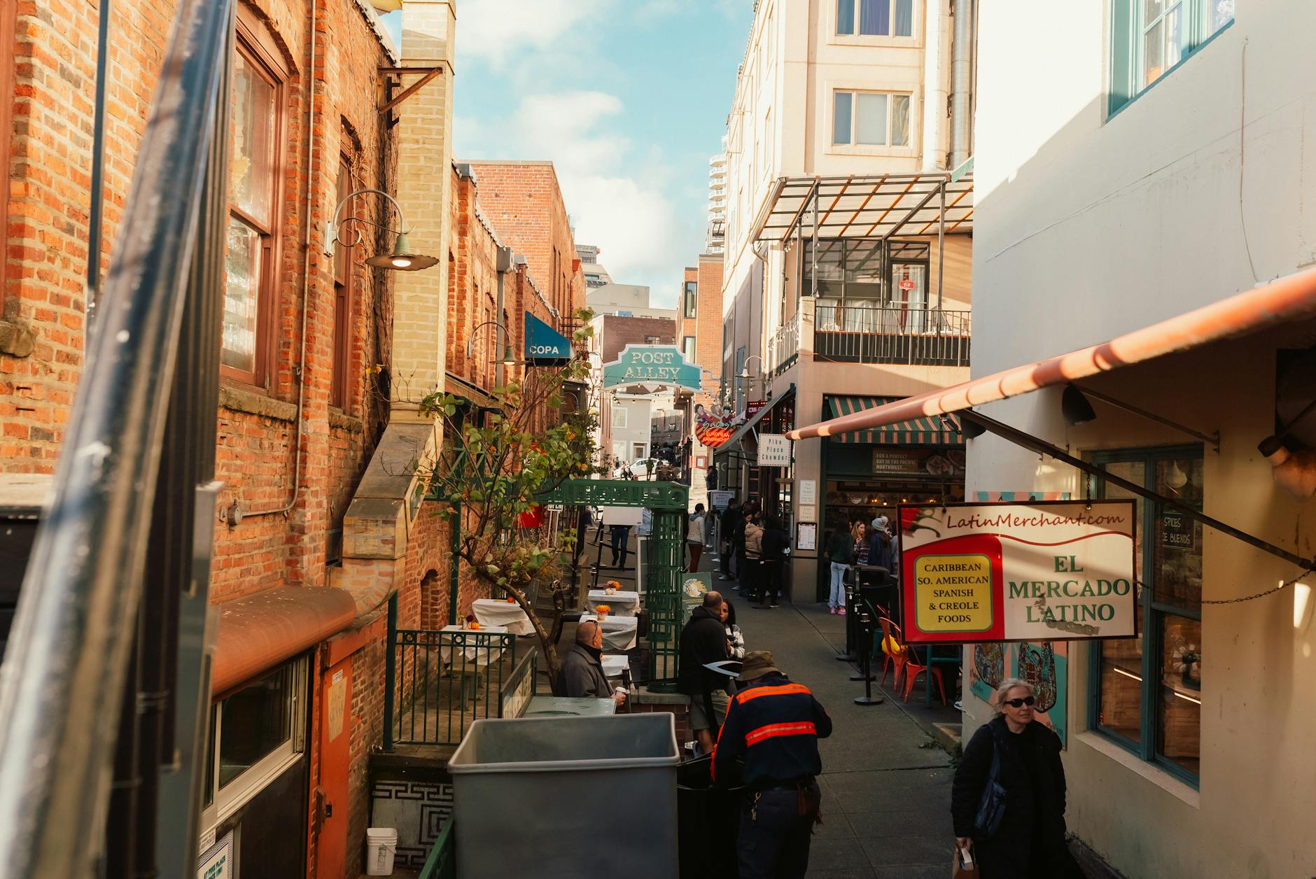 people walking on sidewalk near buildings