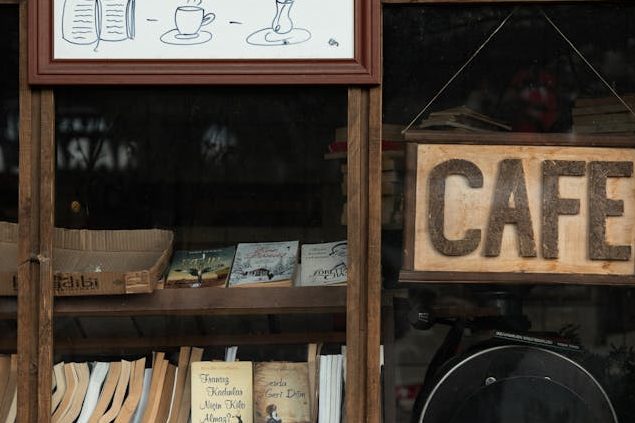 sidewalk cafe with books in the window