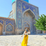 woman at a mosque in samarkand uzbekistan by mylifesatravelmovie