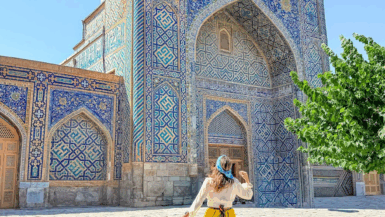 woman at a mosque in samarkand uzbekistan by mylifesatravelmovie