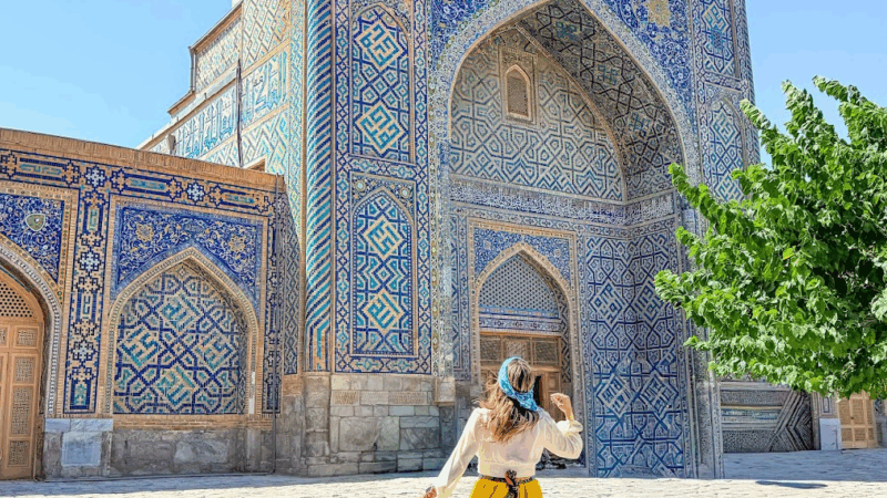 woman at a mosque in samarkand uzbekistan by mylifesatravelmovie