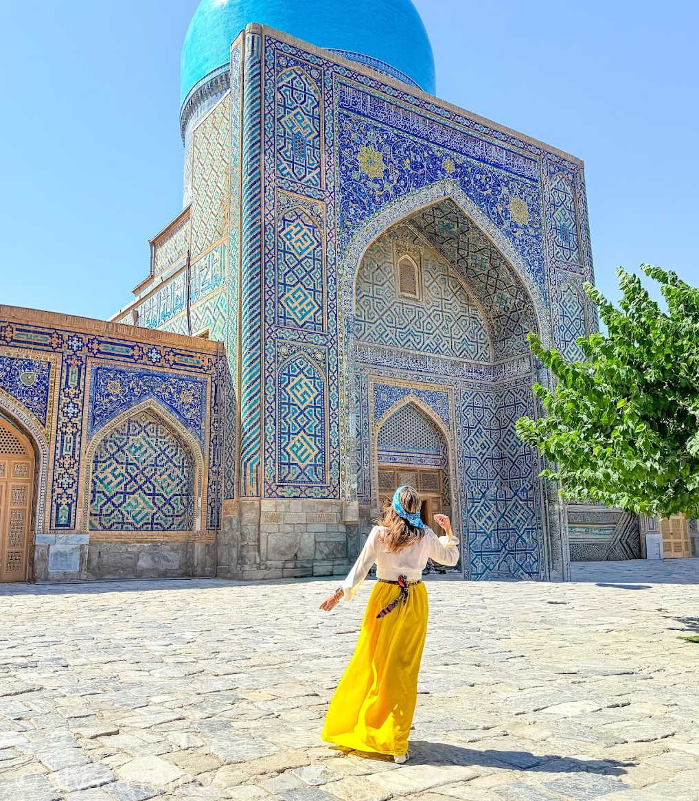 woman at a mosque in samarkand uzbekistan by mylifesatravelmovie