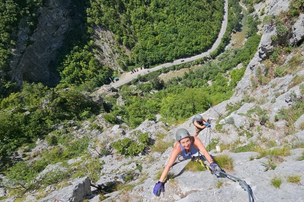 Two women climbing a Via Ferrata in Peja Kosovo