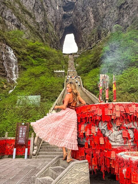 Traveled solo in China earlier this year and became slightly obsessed! Out of the now 150 countries I’ve been to, I think it might actually be in my top 10!

That’s why I had to add it to our group trips! We are officially 1 year away from our Zhangjiajie - Chongqing - Beijing/Shanghai group adventure with just a few spots left! 

***Comment “China” and I’ll send you the trip info, and also an option to see my general blog post about it with tips (but PLZ don’t copy it for business purposes 🙏)

If you’re on my level of adventure-obsessed, this is definitely the trip for you! It includes all of my favorite activities I did, like the Skyscraper Rappelling, Cloud Walk and Swing, Motorcycle video shoot, and alllllll the Avatar mountain things!
 
Btw can you tell I’m wearing an “Avatar” outfit doing the zip line in the Avatar Mountains? 🤓 

I’ll also be curious to see if we can recreate my Great Wall of China pics with no people from when I was there almost 10 years ago…before people-remover was a basic editing feature!