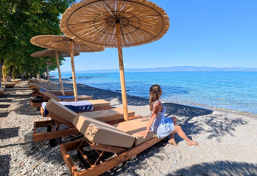 A beach on Lake Ohrid in  North Macedonia featuring travel blogger/influencer Alyssa Ramos mylifesamovie.com
