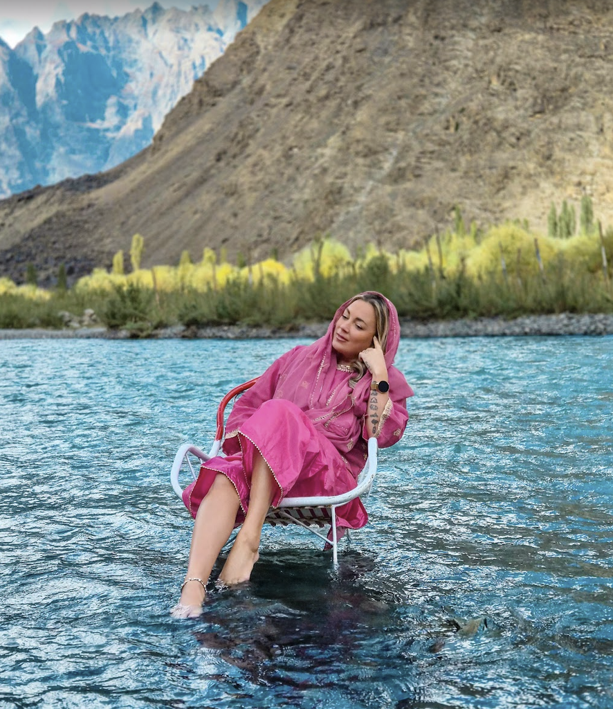 Solo female travel influencer Alyssa Ramos (@mylifesatravelmovie) at a lake in Skardu Pakistan