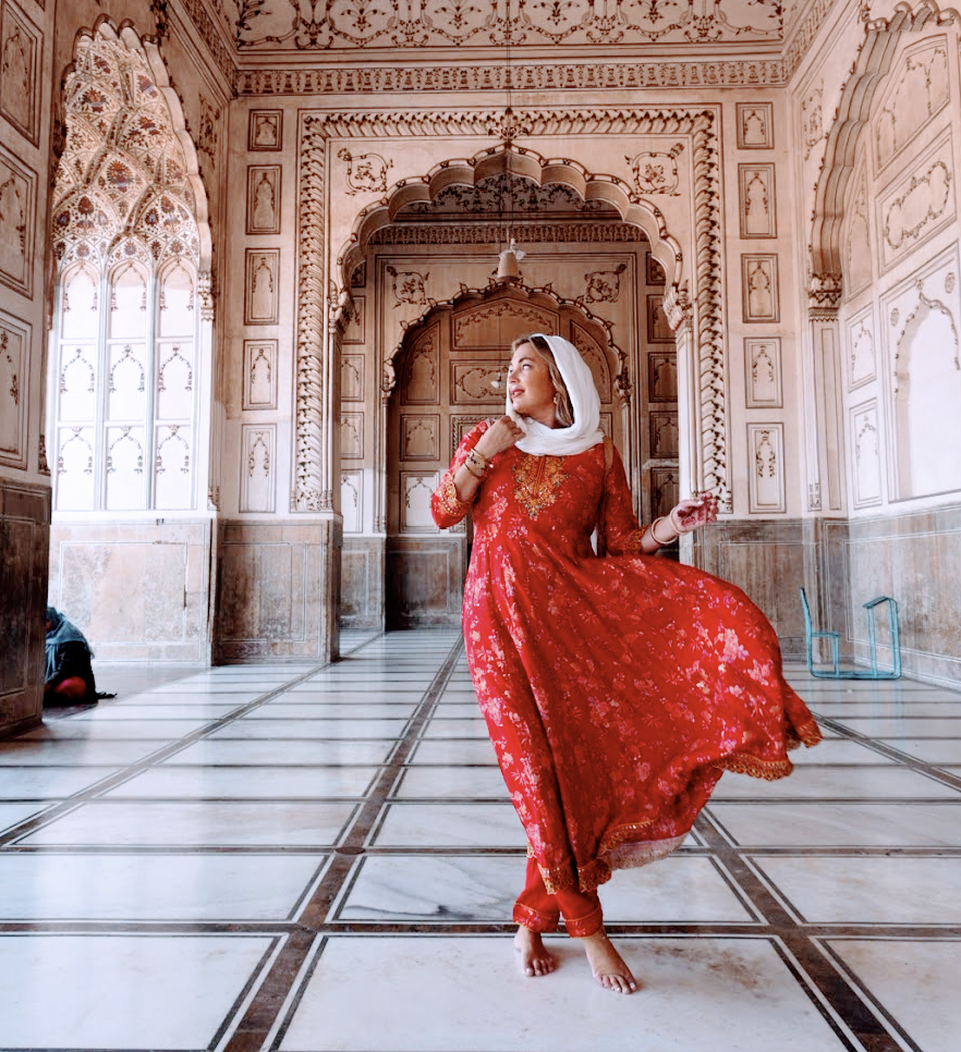 Solo female travel influencer Alyssa Ramos (@mylifesatravelmovie) inside the mosque in Lahore Pakistan